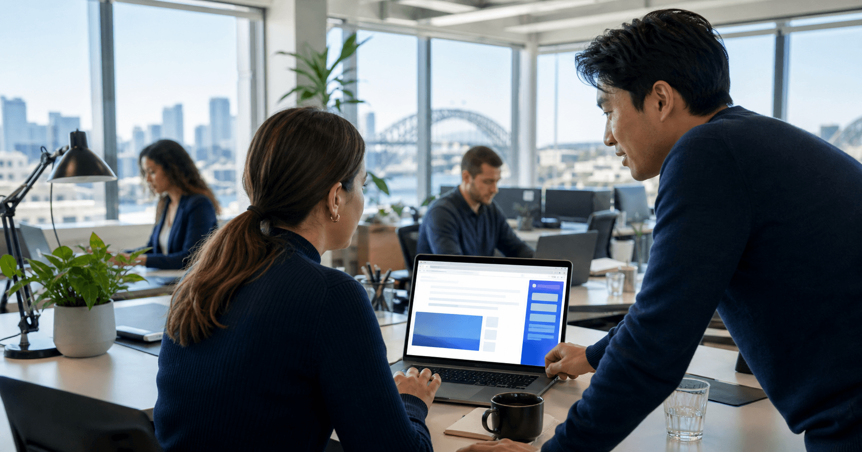 OnIT Solutions team consulting with a Sydney business client on AI chatbot strategy