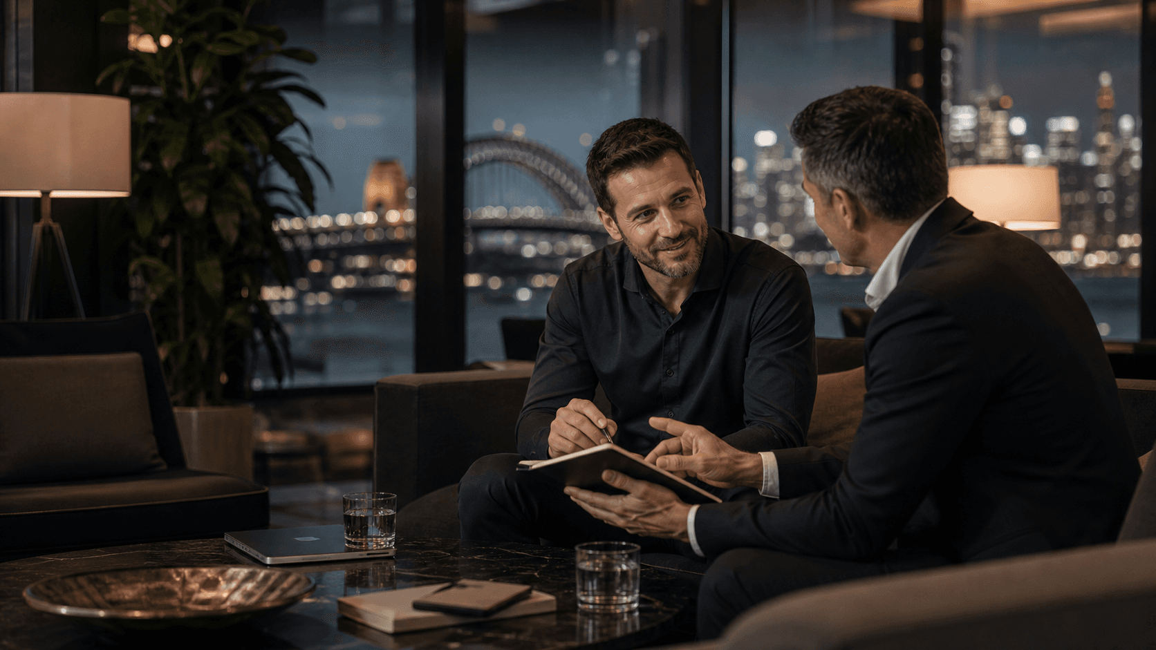 OnIT Solutions consultant reviewing agency IT systems with a real estate principal