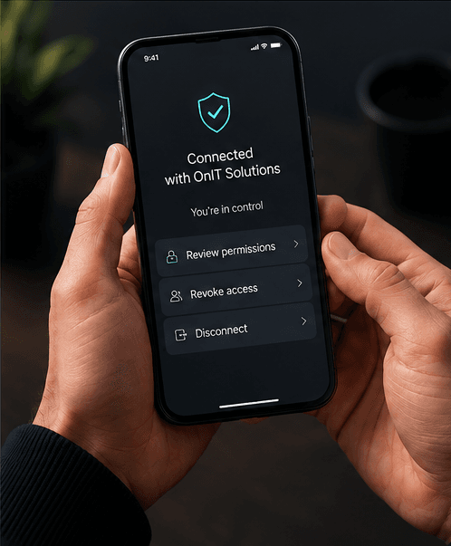 Phone screen showing Connected with OnIT Solutions status with options to review permissions, revoke access and disconnect
